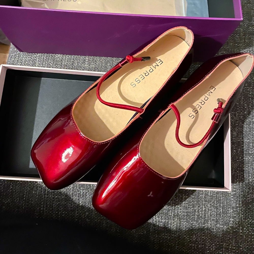new patent leather shoes. never worn because size too small for me.